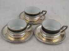 Appraisal: A set of three French teacups in standard silver holders