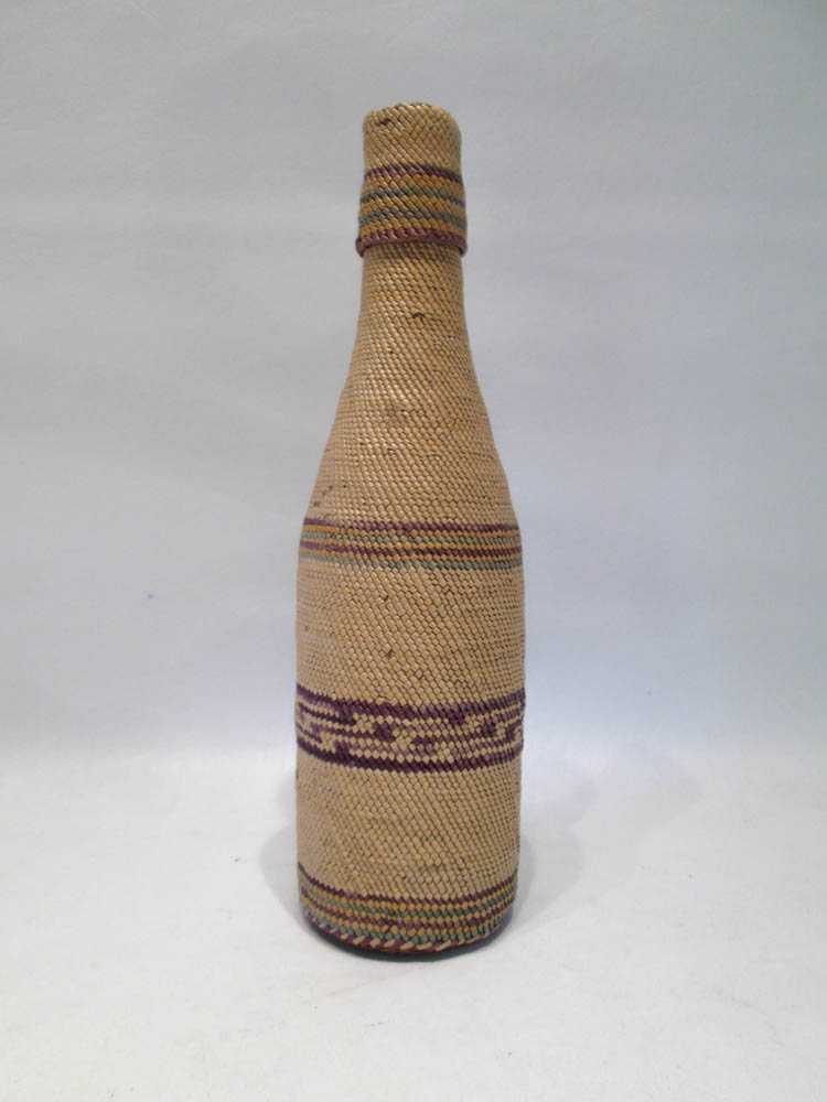 Appraisal: MAKAH BASKET WOVEN COVERED BOTTLE with woven lid Height inches