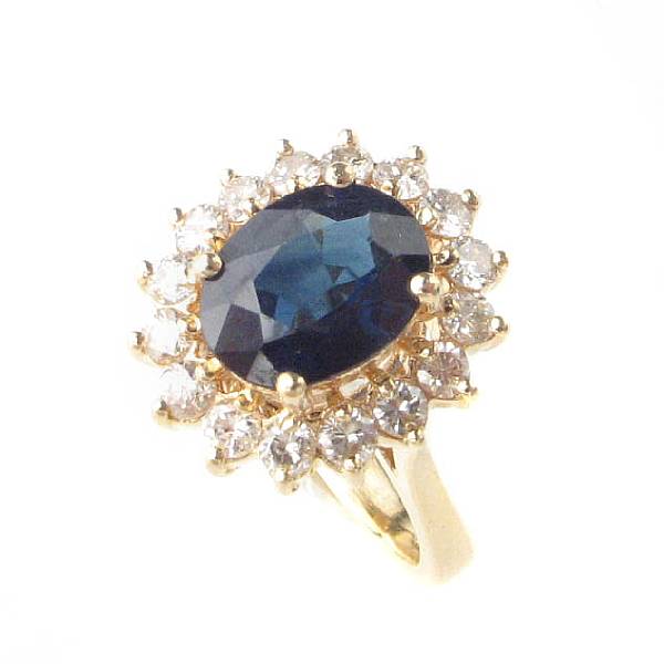 Appraisal: A sapphire diamond and k gold ring centering one oval