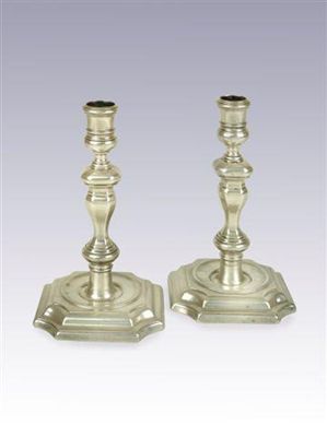 Appraisal: A pair of William III cast candlesticks on canted square