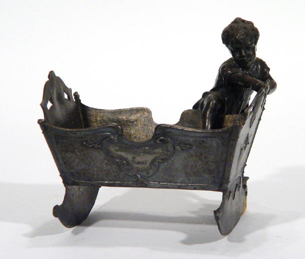 Appraisal: Victorian pewter bowl modelled as a young child climbing into