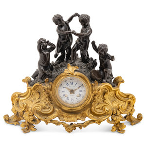 Appraisal: A French Gilt and Patinated Bronze Figural Mantel Clock Raingo