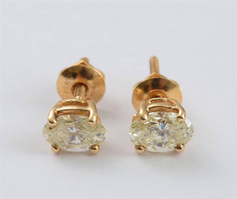 Appraisal: PAIR OF K GOLD AND OVAL DIAMOND STUD EARRINGS Diamonds