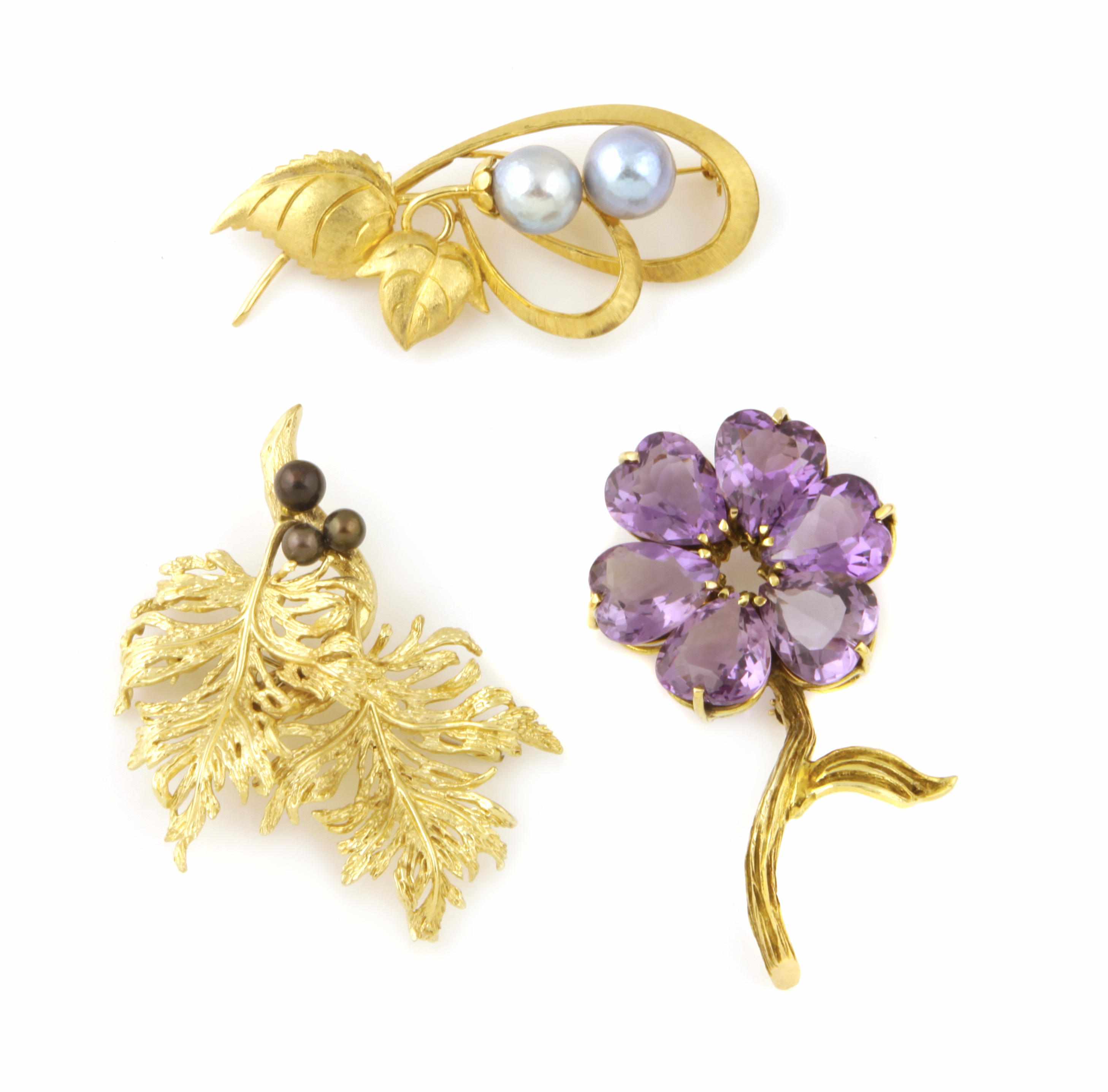 Appraisal: A collection of three gem-set cultured pearl and gold brooches