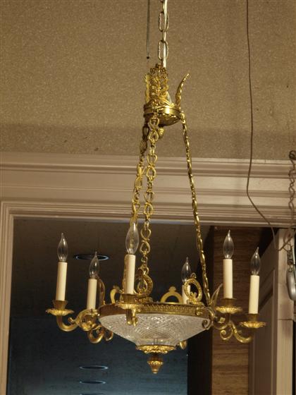 Appraisal: Empire style gilt metal and cut glass six light chandelier