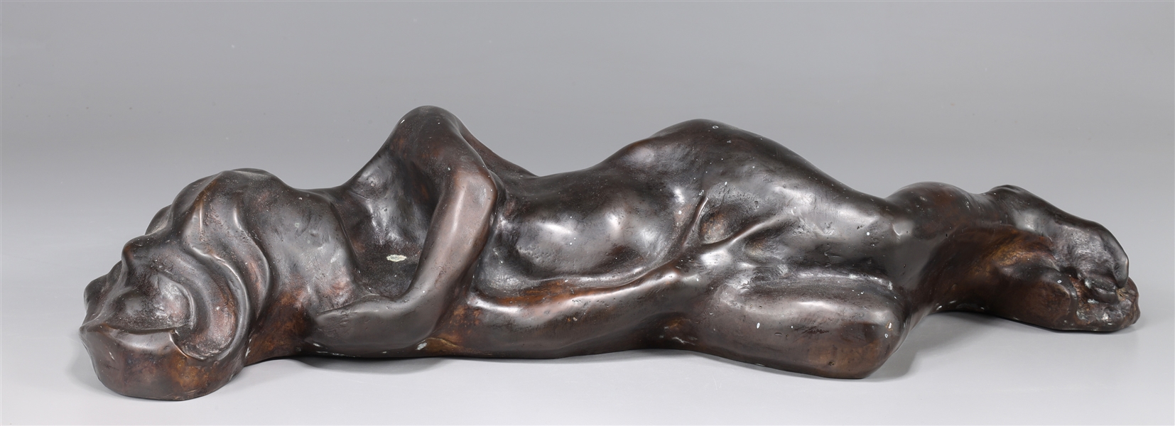 Appraisal: Erotic bronze nude figure of a female lying on her