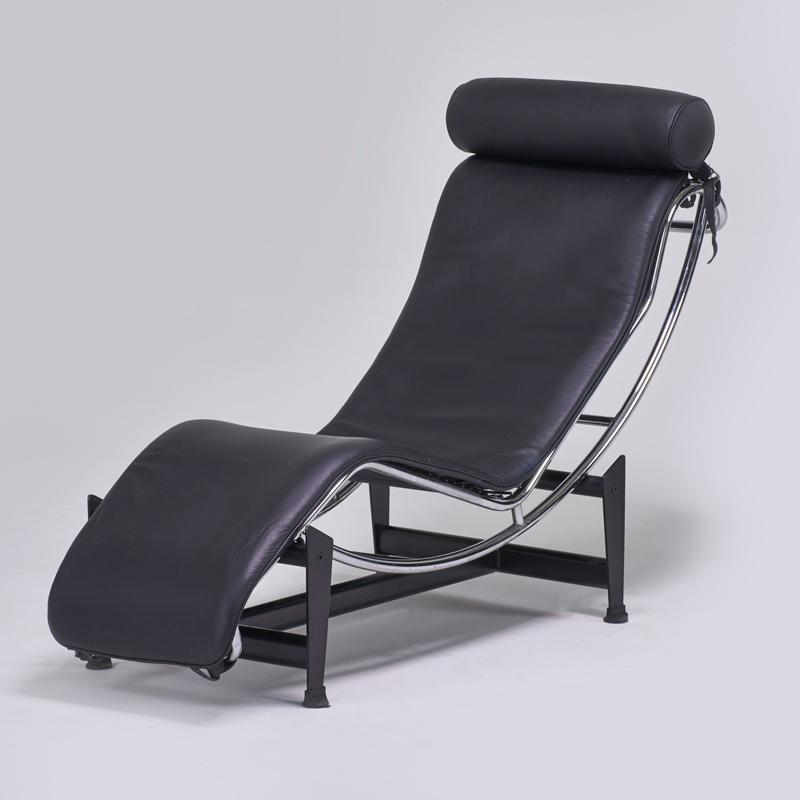 Appraisal: STYLE OF LE CORBUSIER Adjustable chaise lounge s Enameled and