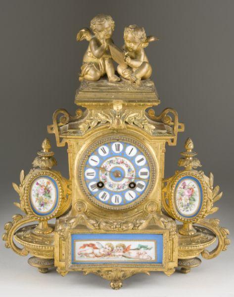 Appraisal: French Figural Mantel Clock time and strike brass movement with