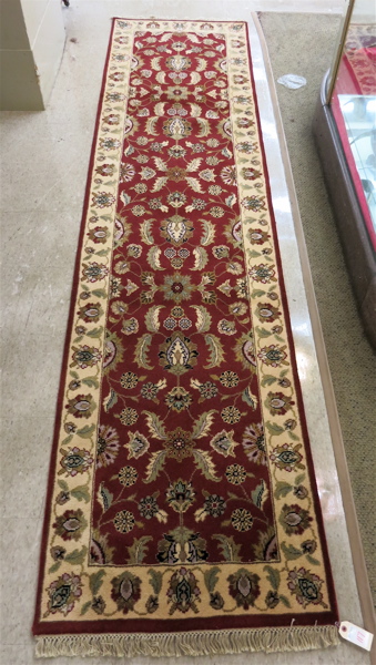 Appraisal: HAND KNOTTED ORIENTAL RUNNER Indo-Persian having an overall floral design