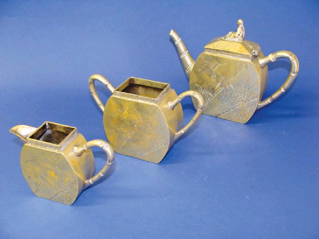 Appraisal: AN AESTHETIC PERIOD EPNS TEASET comprising a straight-sided teapot with