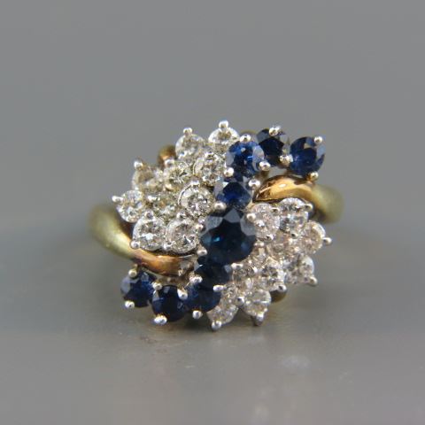 Appraisal: Sapphire Diamond Ring round diamonds totaling carat and rich blue