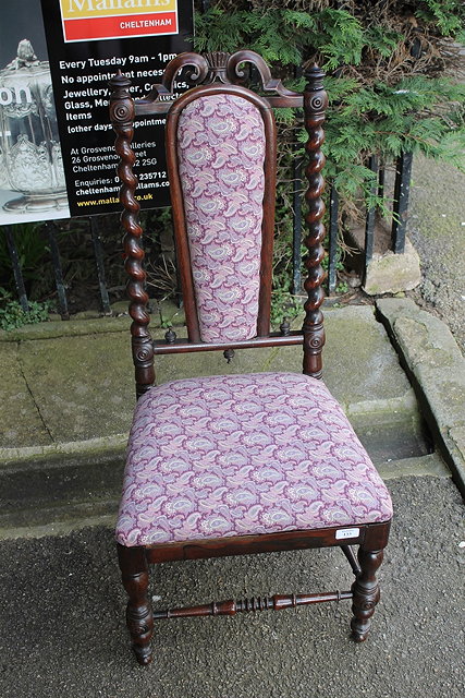 Appraisal: A VICTORIAN WALNUT NURSING CHAIR with matching footstool and a