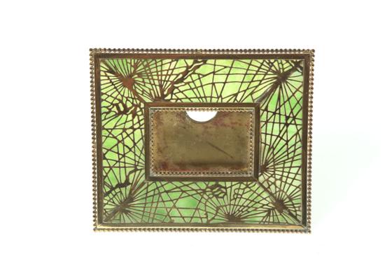 Appraisal: CALENDAR HOLDER American th century Perpetual calendar frame marked ''Tiffany