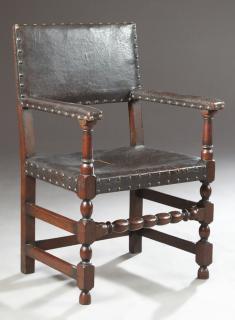 Appraisal: Spanish Oak and Leather-Upholstered Armchair th c the padded rectangular