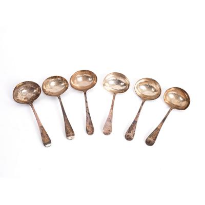 Appraisal: Four old English pattern silver sauce ladles W Sheen London