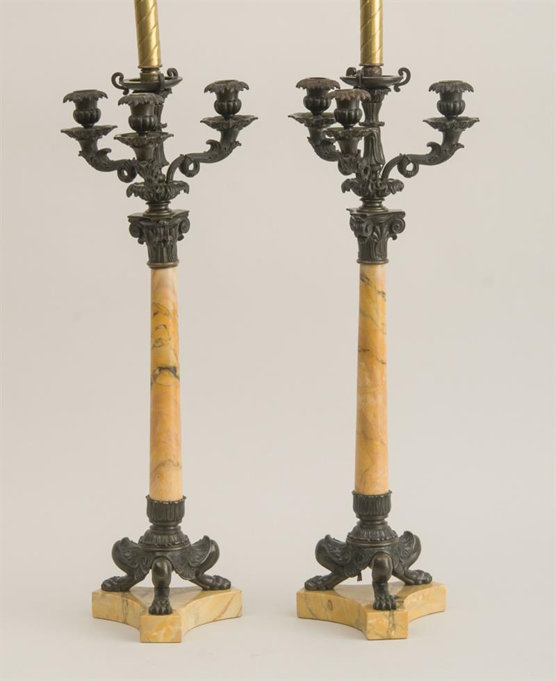 Appraisal: PAIR OF CHARLES X BRONZE-MOUNTED MARBLE FOUR-LIGHT CANDELABRA Each with