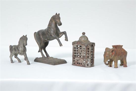 Appraisal: FOUR CAST IRON BANKS An elephant h A horse h