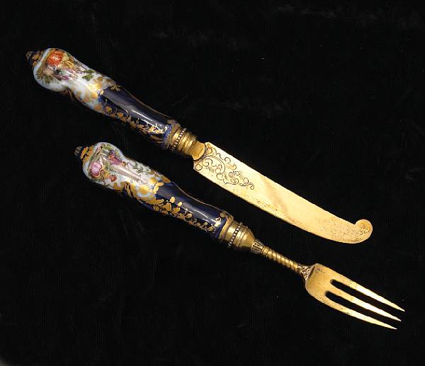 Appraisal: A continental silver gilt and porcelain dessert flatware set for