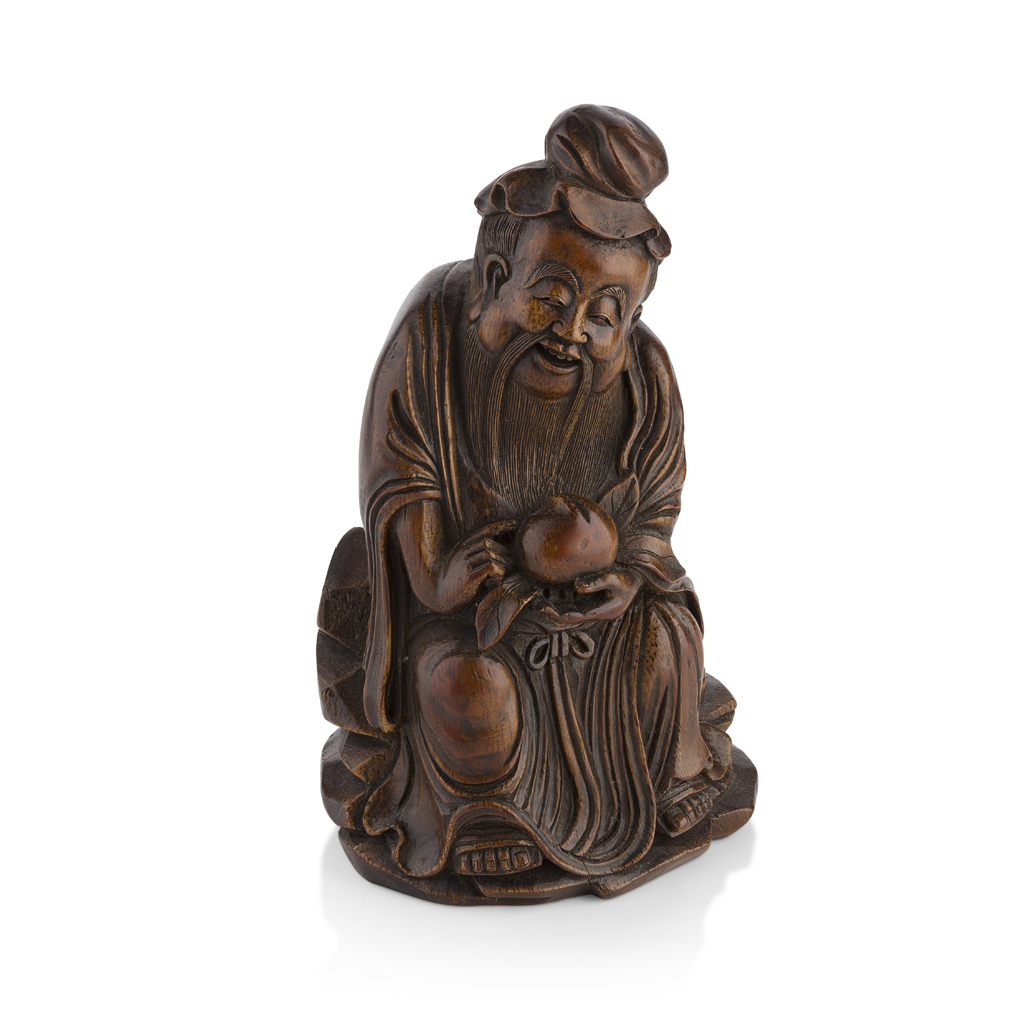 Appraisal: BAMBOO CARVING OF AN IMMORTAL HOLDING A PEACH the figure