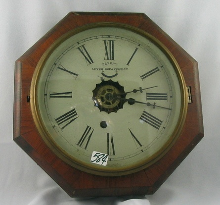 Appraisal: A NEW HAVEN WALNUT CASED WALL CLOCK eight and one