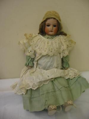 Appraisal: An Armand Marseille bisque head doll with brown sleeping eyes