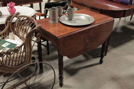 Appraisal: DROP LEAF TABLE Cherry with shaped leaves and foliate carved