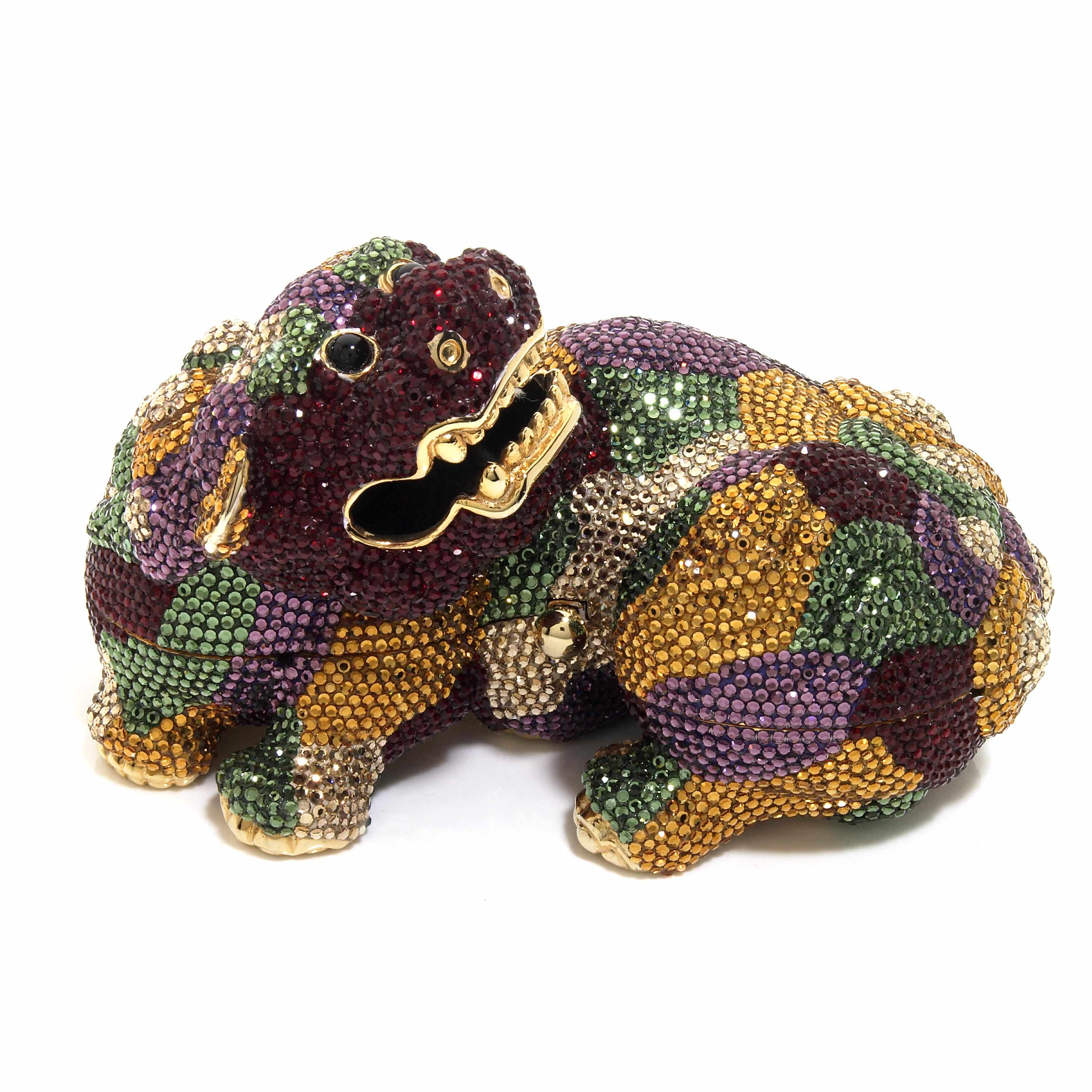 Appraisal: A multi-colored crystal Foo Dog minaudiere interior with a comb