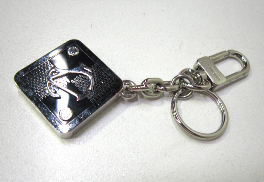 Appraisal: A LOUIS VUITTON KEY RING A LOUIS VUITTON KEY RING