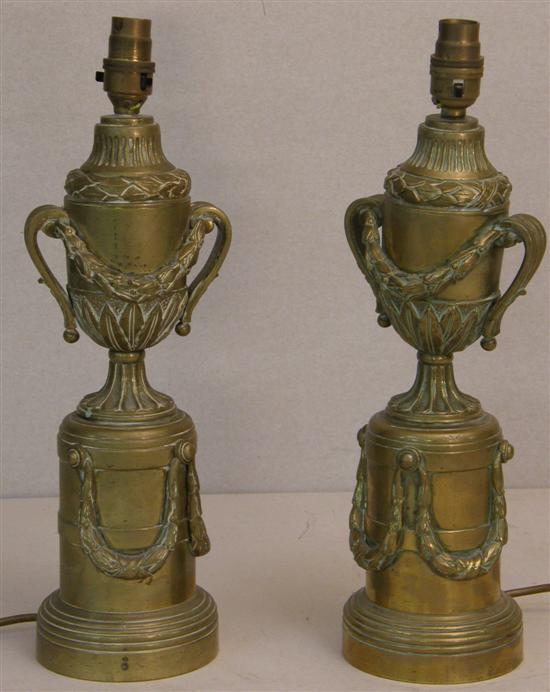 Appraisal: Pair of brass urn shaped lamps with moulded garland decoration