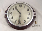 Appraisal: An Art Deco Frence bakelite mechanical wall clock by Japy