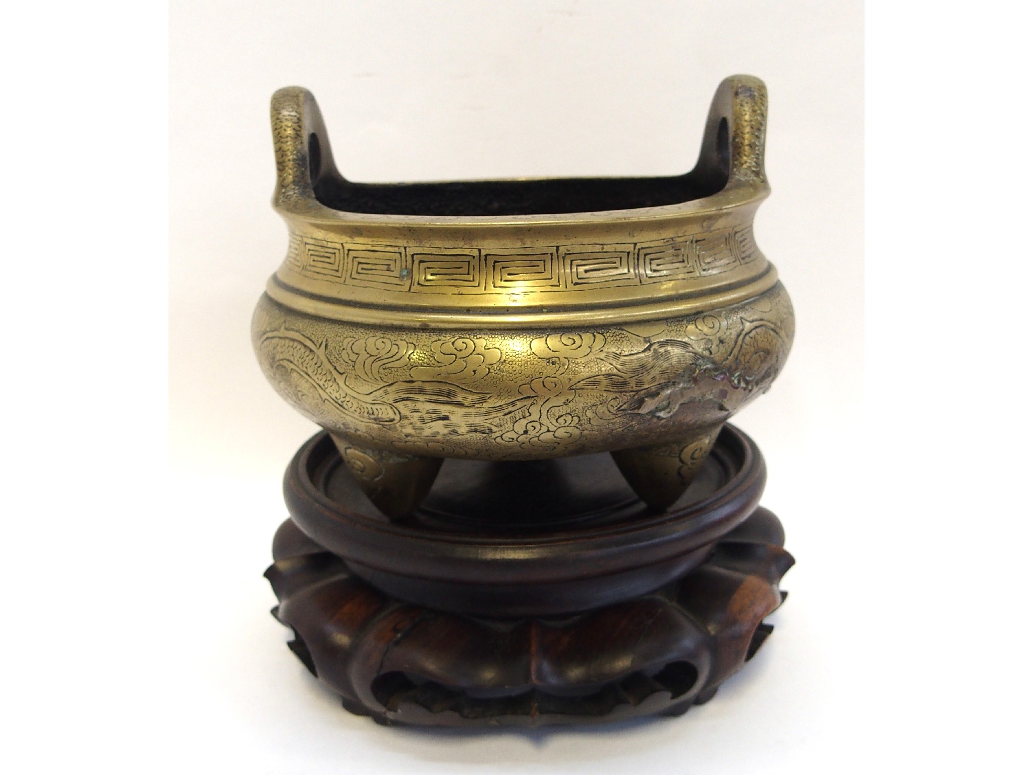 Appraisal: Chinese brass censer on wooden stand decorated with dragons