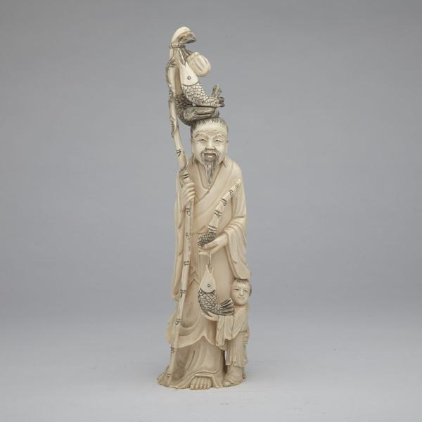 Appraisal: Ivory Carved Figure of a Fisherman Circa s The elderly