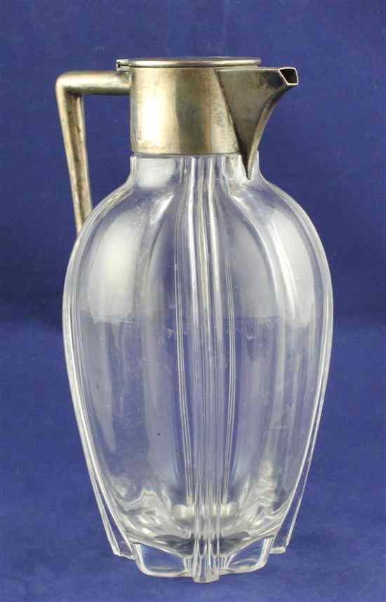 Appraisal: An Edwardian silver mounted glass claret jug of ovoid form