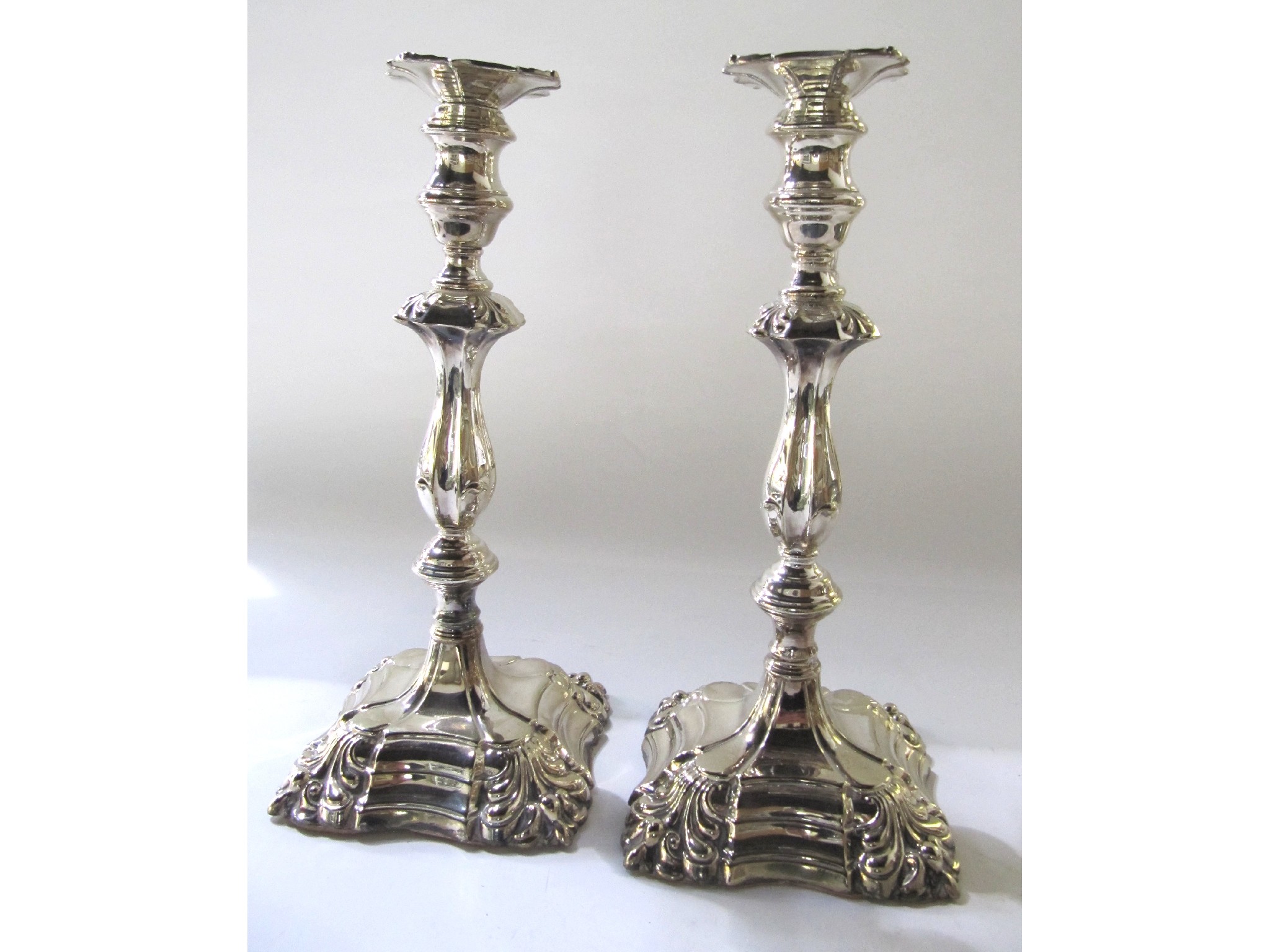 Appraisal: A pair of silver plated candlesticks