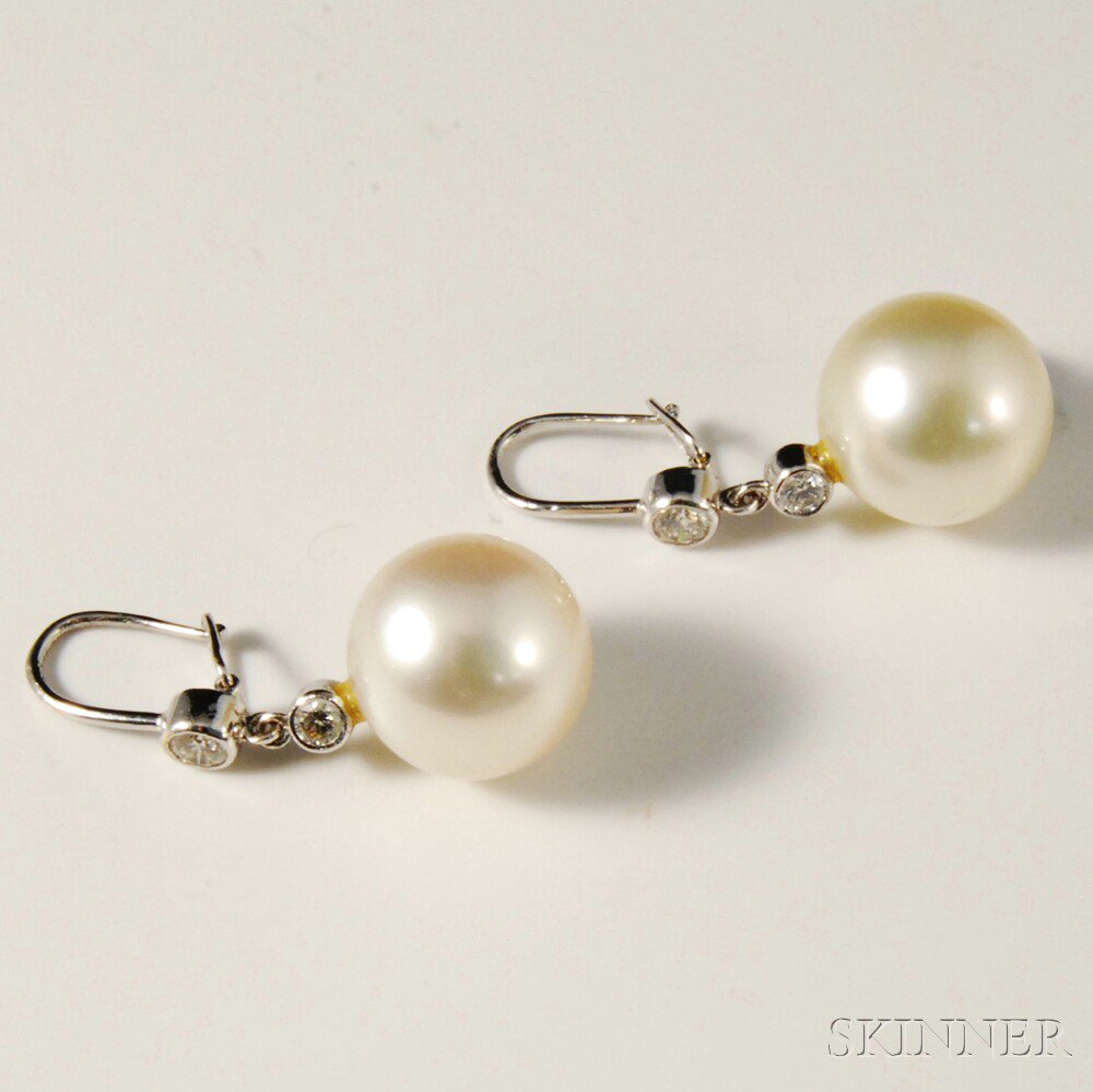 Appraisal: Diamond and Pearl Earrings rhodium-plated set with two diamonds and