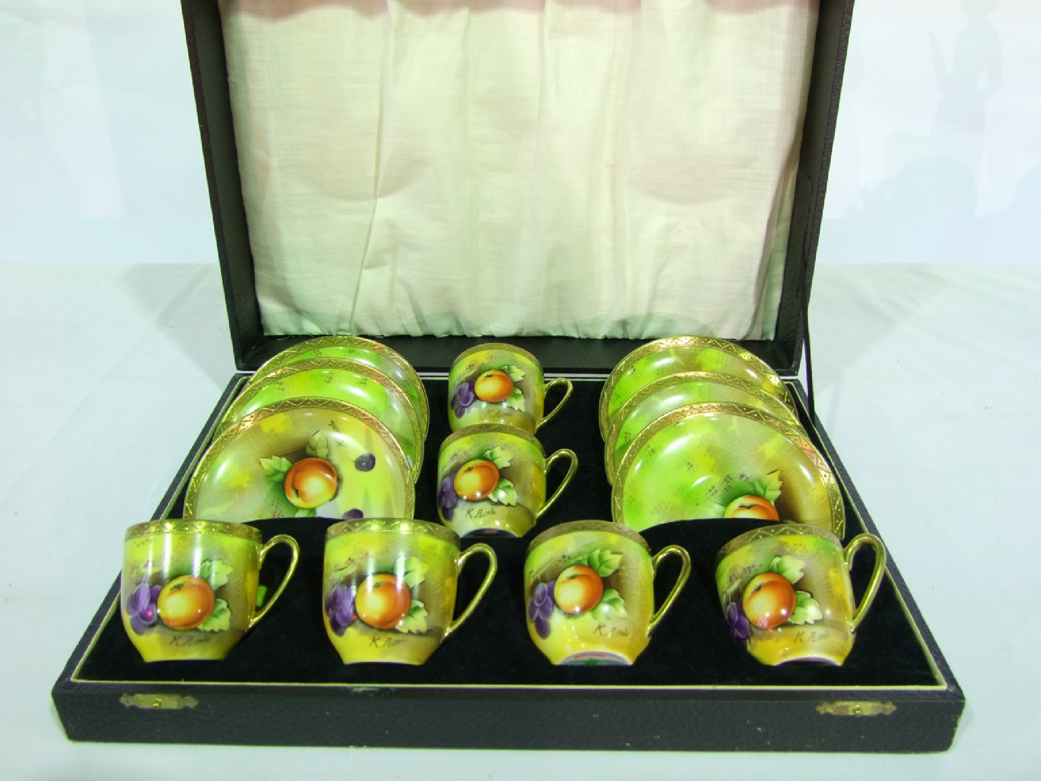 Appraisal: A cased set of six Japanese coffee cups and saucers