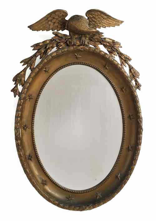 Appraisal: Baltimore Federal giltwood oval mirror ca with a large carved