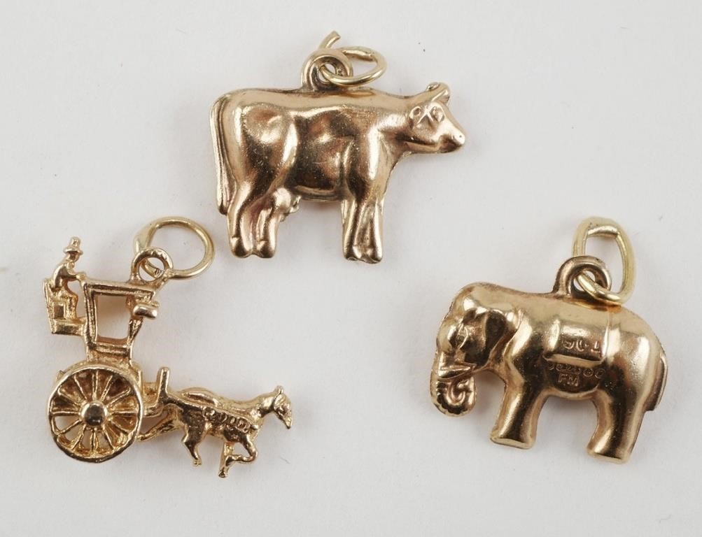 Appraisal: Three or KT yellow gold bracelet or jewelry charms cow