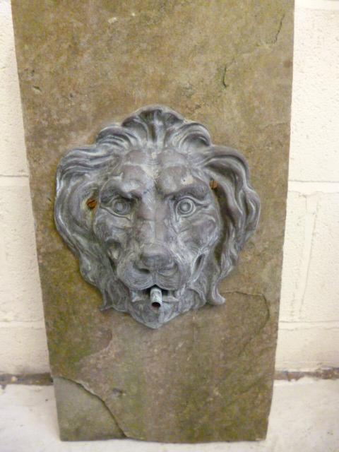 Appraisal: A BRONZE WALL WATER SPOUT MASK modelled as a lion's