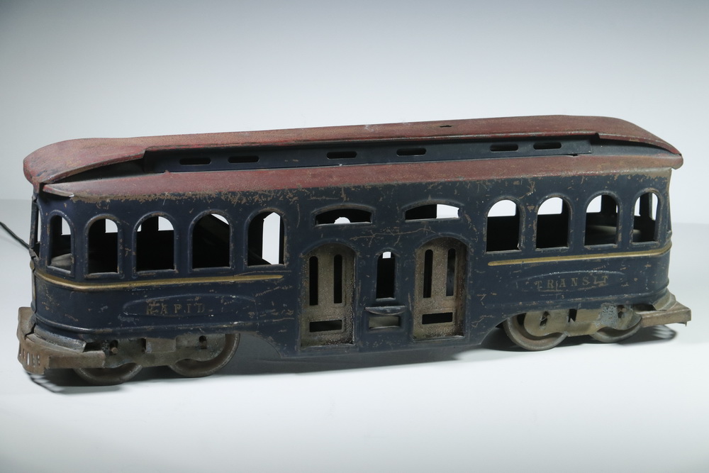 Appraisal: TROLLEY CAR Early tin painted rapid transit trolley car Fly