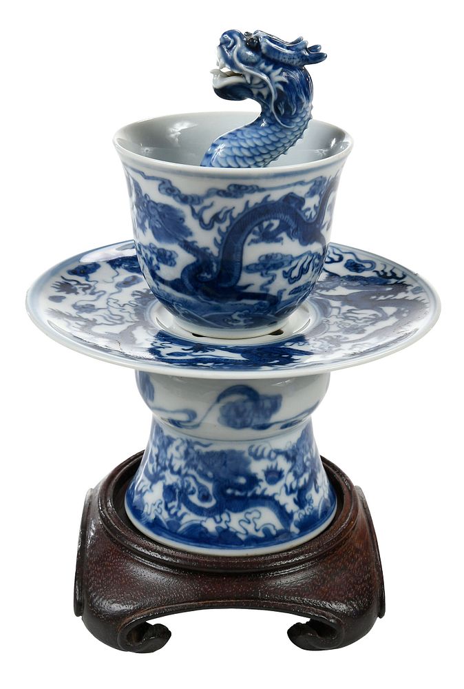 Appraisal: Chinese Blue and White Dragon Trick Cup on Stand Qing