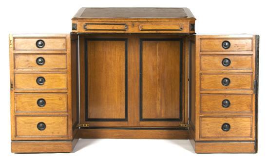 Appraisal: Davenport Desk the leather inset slope lift-top over two swing