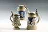 Appraisal: STEINS - Lot of three Mettlach steins L floral relief