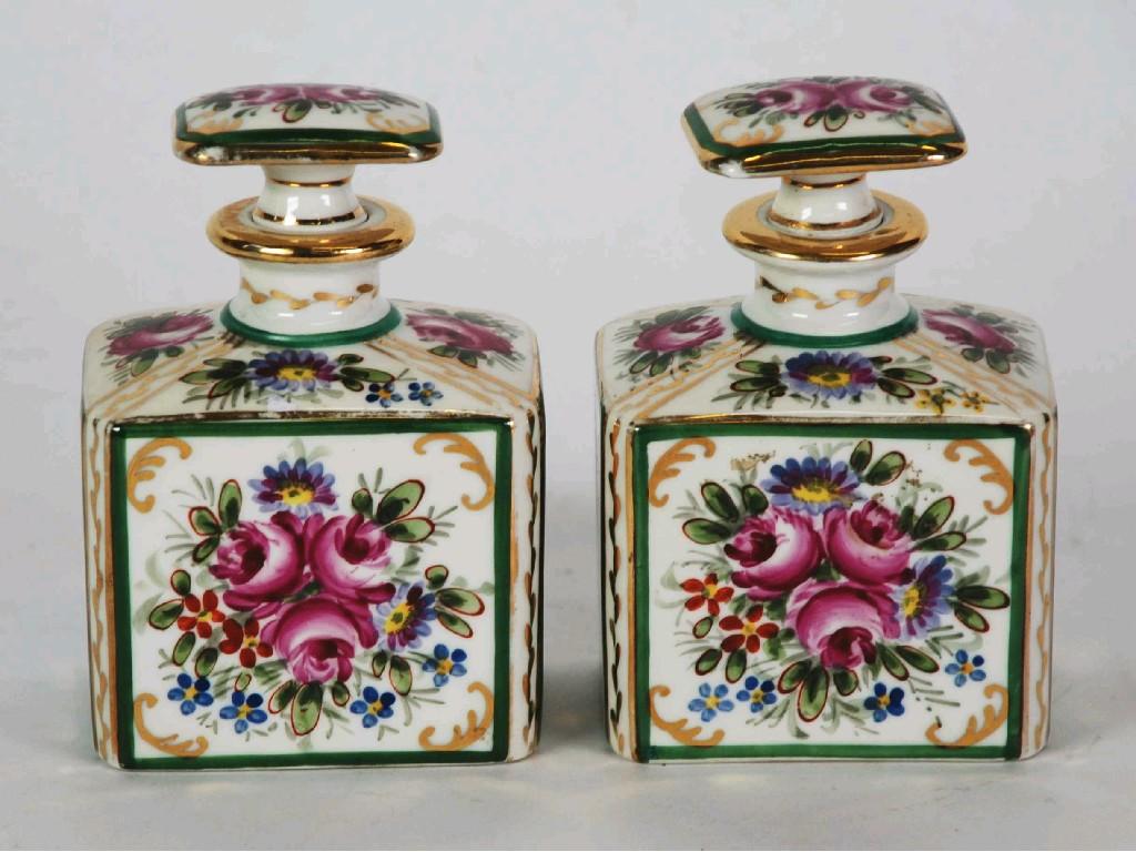 Appraisal: A PAIR OF FRENCH PORCELAIN EAU-DE-COLOGNE BOTTLES WITH STOPPERS enamelled