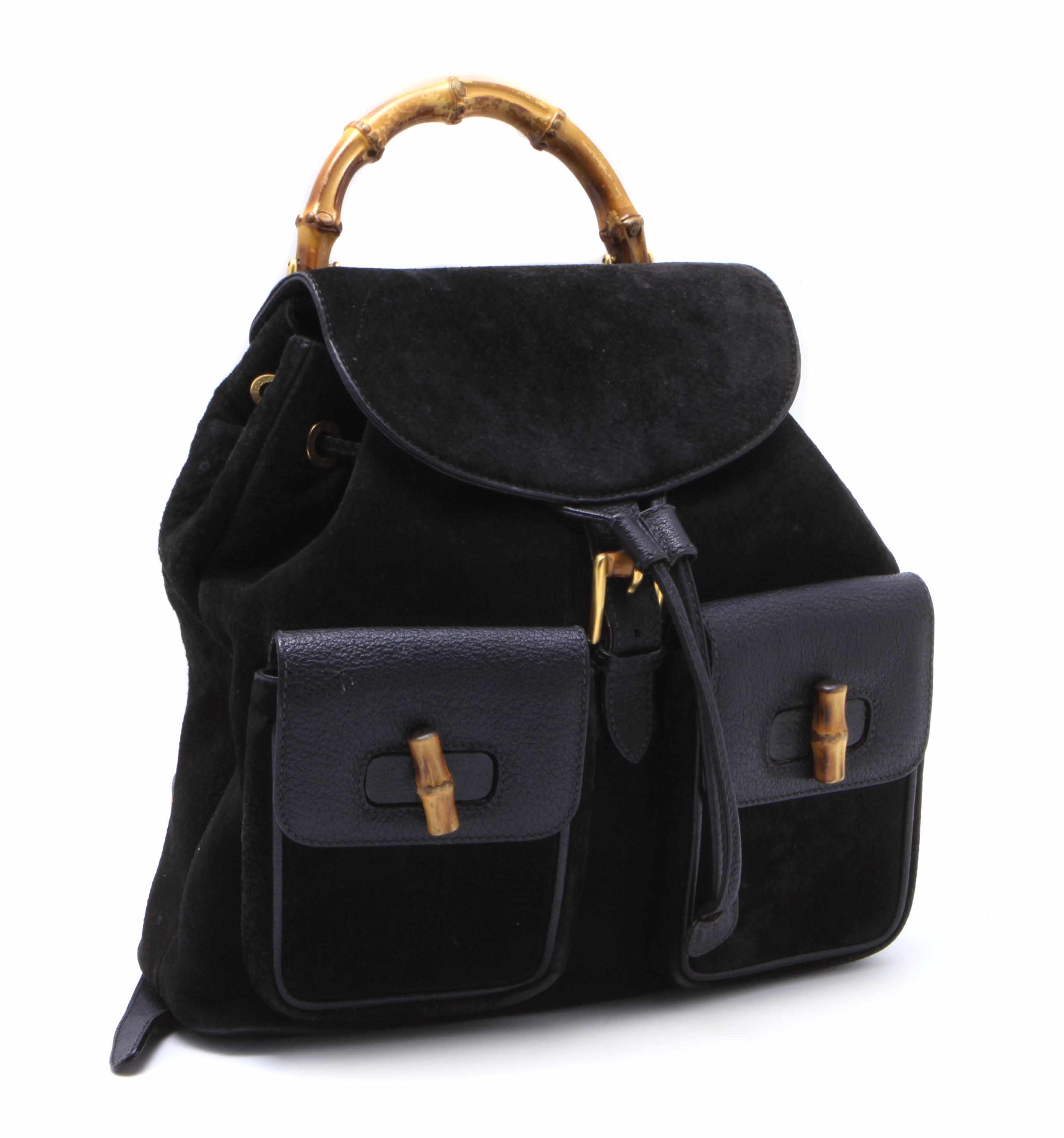 Appraisal: A Gucci black suede and leather backpack with bamboo handles