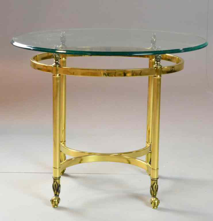 Appraisal: Mid Century Oval Brass Glass Top End TableWith a heavy