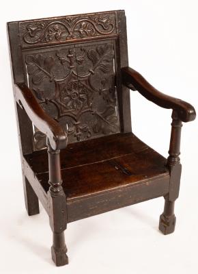 Appraisal: A child's oak chair the back with th Century carved