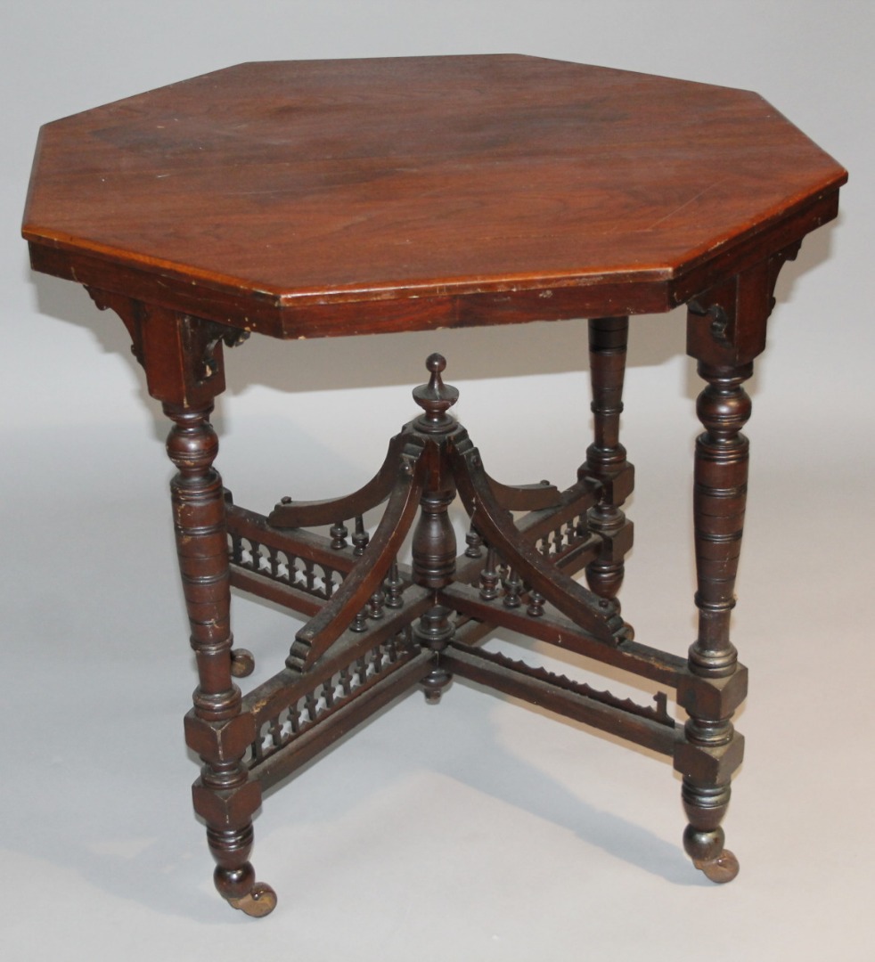 Appraisal: An Edwardian walnut stained occasional table the octagonal top raised