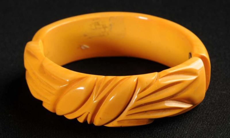 Appraisal: Bakelite Carved Yellow Hinged Bracelet Condition Excellent Size - Dia