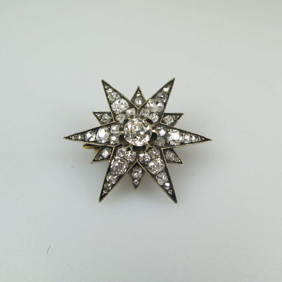 Appraisal: k Yellow Gold And Silver Starburst Brooch set with various